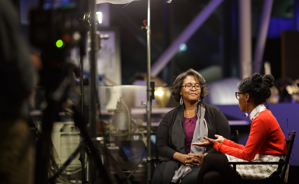 Two people in a media interview